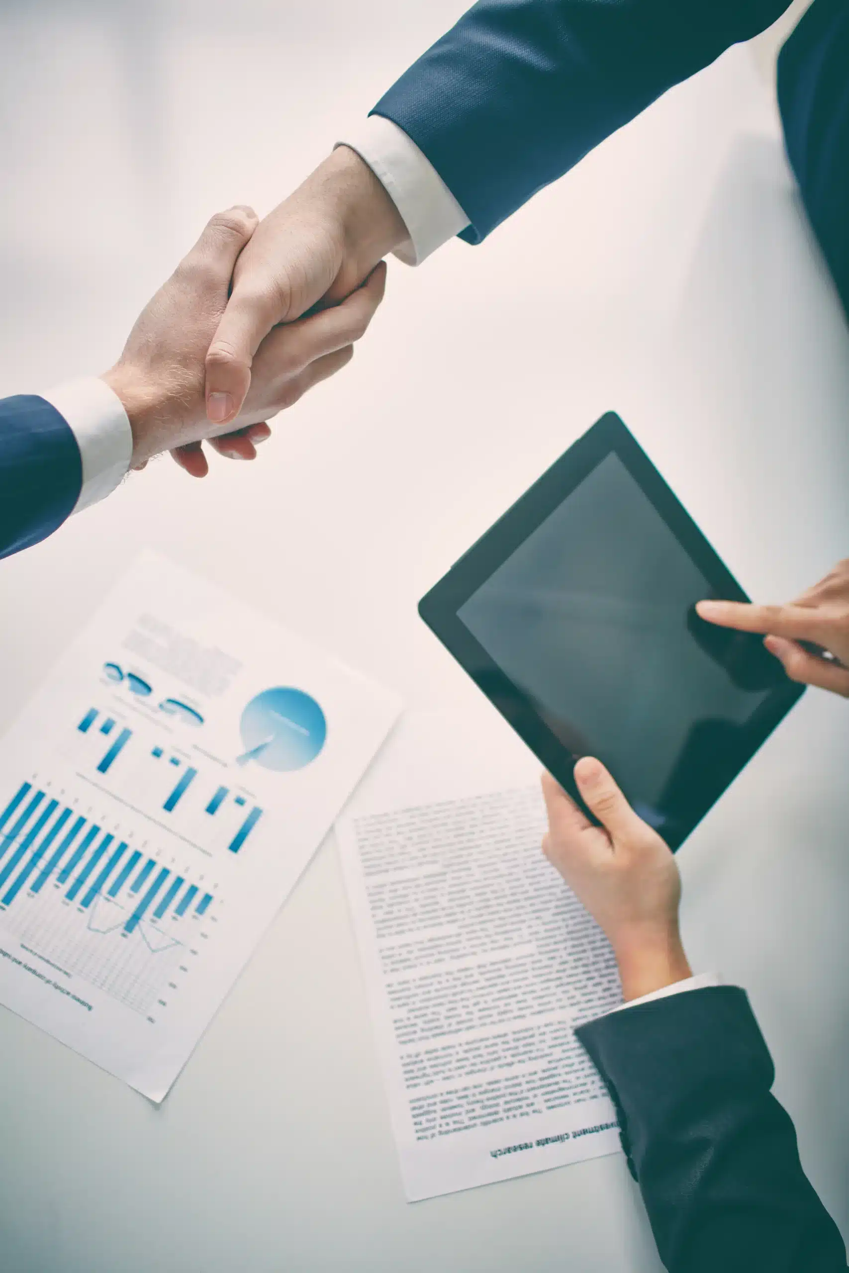 businessman shaking hands with client scaled